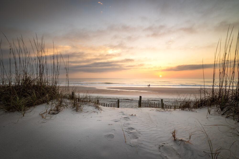 The sun rises over Amelia Island, Florida, on a quiet morning where the dunes give way to open water. It's a long way from the mountains, but it's worth the trip.