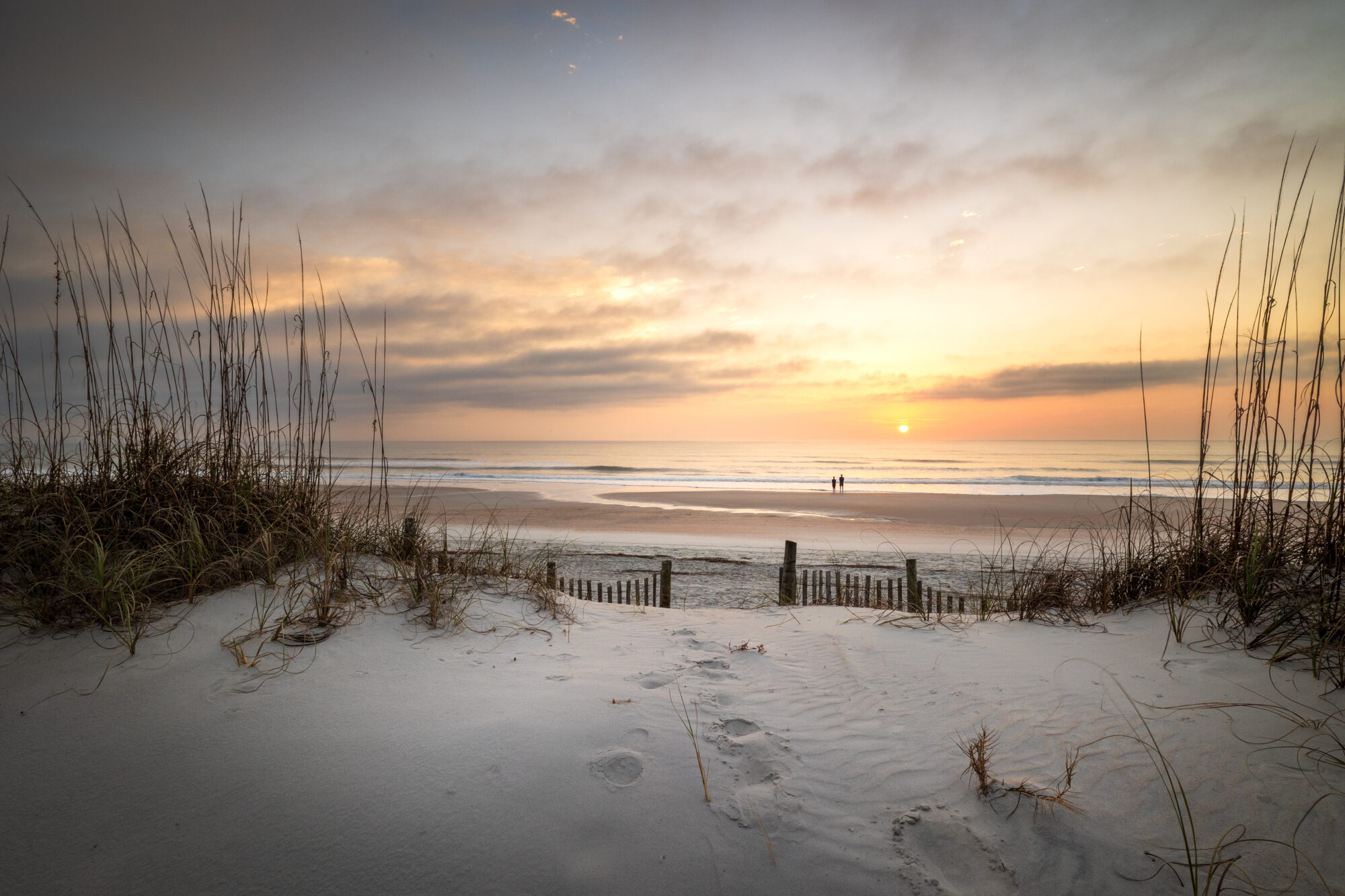 The sun rises over Amelia Island, Florida, on a quiet morning where the dunes give way to open water. It's a long way from the mountains, but it's worth the trip.